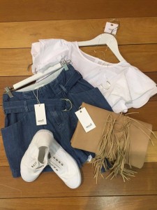Denim chambray shorts with fringed clutch and trainers for a casual day look. (SEED in the Canberra Centre)